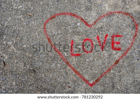 Red heart on concrete floor.
Valentines day, love concept.