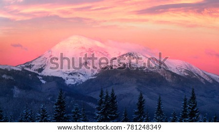 Houses of shepherds in the Carpathians, Ukraine, a tourist trek in winter gives special extreme sensations of nature on top against the backdrop high ridge of Chernogory from Goverla