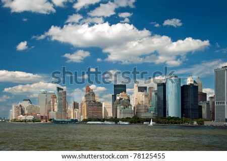 Lower Manhattan panorama in New York City with beautiful blue sky.