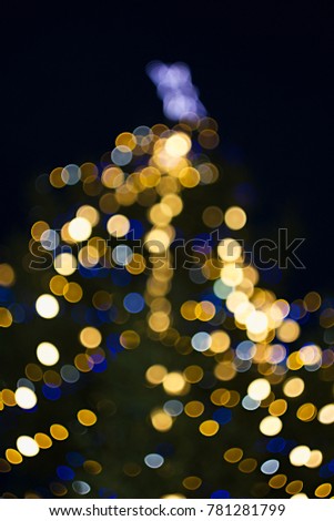 Christmas background - lights and reflections of a Christmas tree, bokeh bubbles.