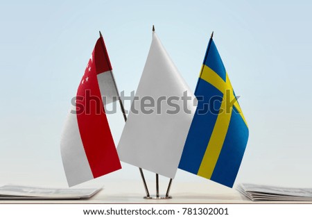 Flags of Singapore and Sweden with a white flag in the middle