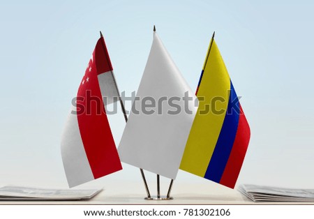 Flags of Singapore and Colombia with a white flag in the middle