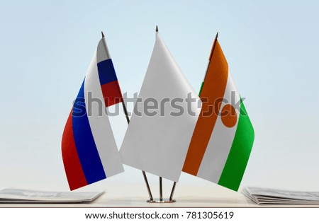 Flags of Russia and Niger with a white flag in the middle