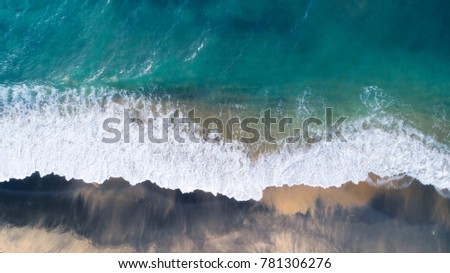 Aerial View of Waves and Beach on Early Morning