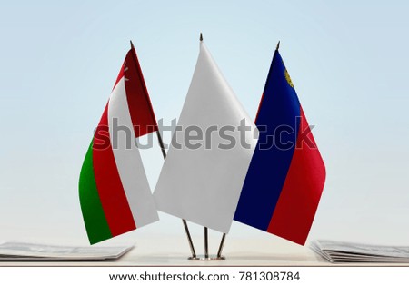 Flags of Oman and Liechtenstein with a white flag in the middle