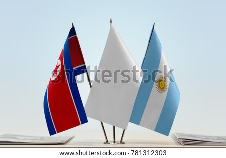 Flags of North Korea and Argentina with a white flag in the middle