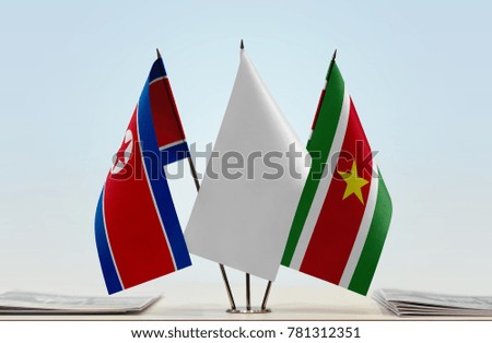 Flags of North Korea and Suriname with a white flag in the middle