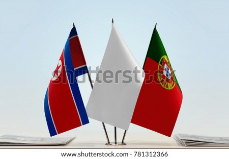 Flags of North Korea and Portugal with a white flag in the middle