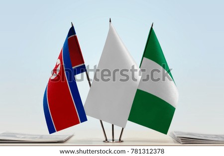Flags of North Korea and Nigeria with a white flag in the middle