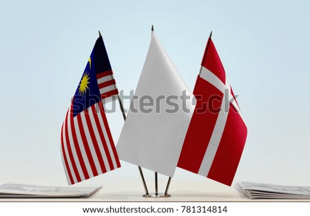 Flags of Malaysia and Denmark with a white flag in the middle