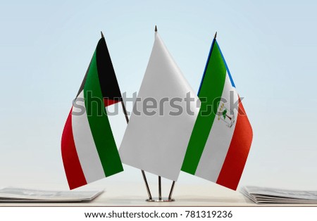 Flags of Kuwait and Equatorial Guinea with a white flag in the middle