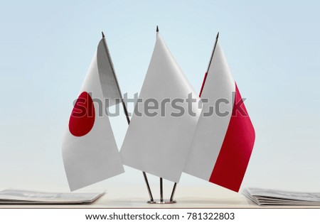 Flags of Japan and Poland with a white flag in the middle