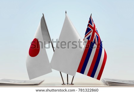Flags of Japan and Hawaii with a white flag in the middle