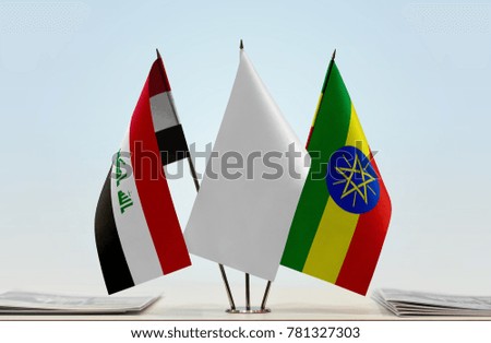 Flags of Iraq and Ethiopia with a white flag in the middle