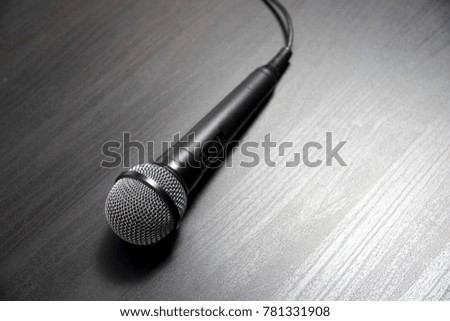 black mic on the wooden table
