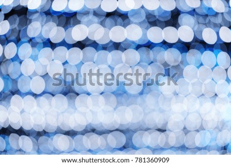 Glamour Blue and Ultra Violet sparkling and purple glitter bokeh. Multicolored Christmas and New Year glowing light abstract bokeh and blurred background.Christmas and holiday concept.