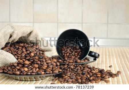 coffee beans with black cups and sack