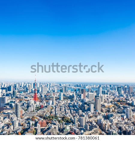 Asia Business concept for real estate and corporate construction - panoramic modern city skyline bird eye aerial view of tokyo tower under bright sun and vivid blue sky in Roppongi Hill, Tokyo, Japan
