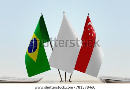 Flags of Brazil and Singapore with a white flag in the middle