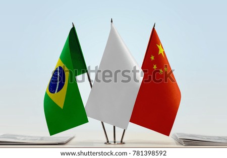 Flags of Brazil and China with a white flag in the middle