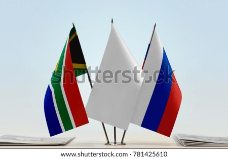Flags of Republic of South Africa and Russia with a white flag in the middle