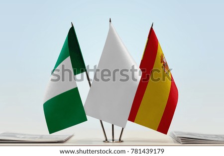 Flags of Nigeria and Spain with a white flag in the middle