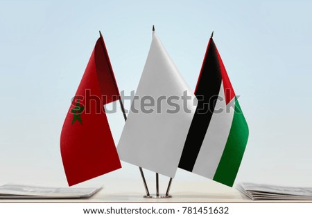 Flags of Morocco and Palestine with a white flag in the middle