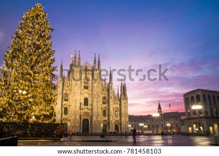Milan, Italy: Duomo square in december with the christmas tree in front of Milan cathedral, at dawn. Royalty-Free Stock Photo #781458103