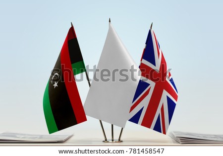 Flags of Libya and United Kingdom with a white flag in the middle