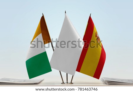 Flags of Ivory Coast and Spain with a white flag in the middle