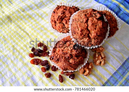 cake sitting on a table with nuts and raisins no people stock photo