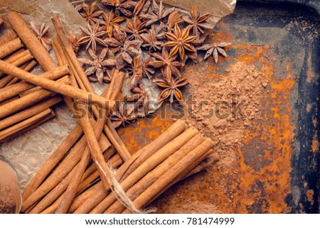 Cinnamon sticks on the rustic wooden background. Selective focus. Shallow depth of field.