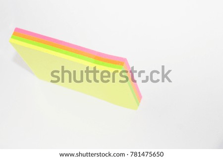 Yellow Green Pink and Orange Sticky Note on White Background