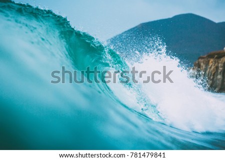 Tropical ocean water surfing swell nobody on a wave