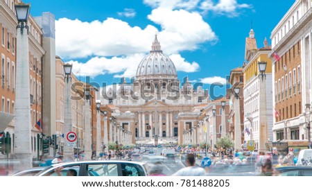 Rome, Italy, Vatican: St. Peter's Basilica in Vatican City State view from Via della Conciliazione, Road of the Conciliation. Blue cloudy sky with traffic on the road Royalty-Free Stock Photo #781488205