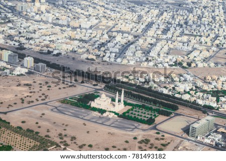 top view or aerial view of a new modern city developing in the heart of desert in the middle east   