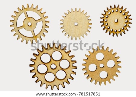 set of five different wooden cog wheels isolated on white background