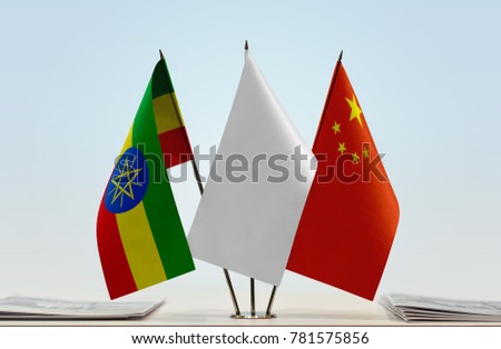 Flags of Ethiopia and China with a white flag in the middle