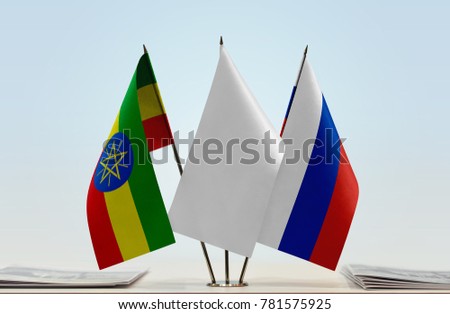 Flags of Ethiopia and Russia with a white flag in the middle