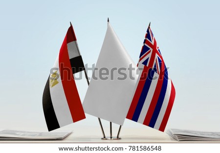 Flags of Egypt and Hawaii with a white flag in the middle
