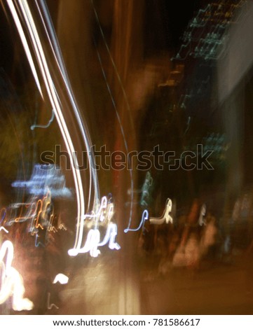Blurred background with road lamp, car light, sign and traffic lighting at night time.