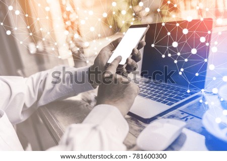 businessman use smartphone and laptop on wooden desk business idea