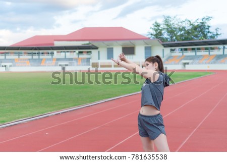 Asian slim woman warm up before work out,slim girl exercise for life,Thailand people,Stretching body before jogging