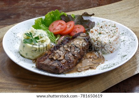 grilled steak with salad and garnish