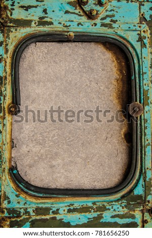 green blue window of aged used car. Car window with rubber frame