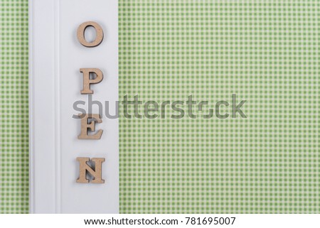 Word open, abstract wooden letters, green white background