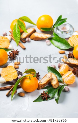 Food and drink, holidays concept. Christmas new year cookies wreath with spices and tangerine. Copy space top view flat lay background