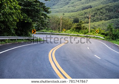 Curve road with sign forrest scenery 