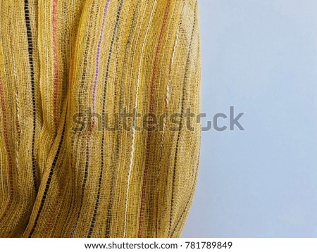 Yellow color scarf on white background with space for writing, winter scarves texture