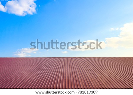 blue sky with red roof